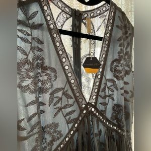 Beautiful PinkBlush maternity dress in blue NWT. Never worn. Size Large.